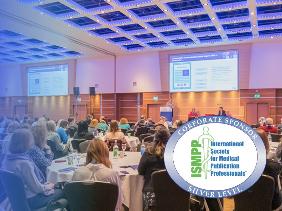 People seated in a conference room listen to a presentation; an overlay highlights the International Society for Medical Publication Professionals’ "Silver Level Corporate Sponsor" badge.