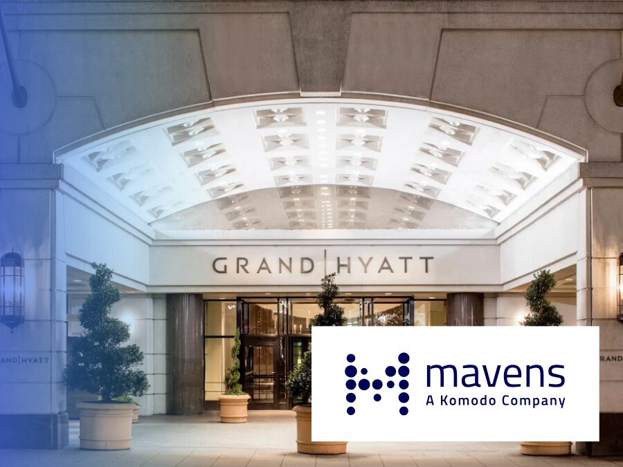 The entrance of the Grand Hyatt hotel is shown with a Mavens, A Komodo Company, logo superimposed in the lower right corner.