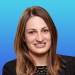 Desy Rolley, Head of Quality at Mavens, smiling in professional headshot against a blue gradient background.